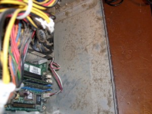 Inside the PC, showing a very dusty chassis