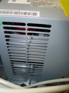 Power supply with cleared ventillation holes after blowing it out with high pressure air