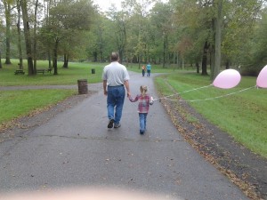 Daddad and K with movie set balloons