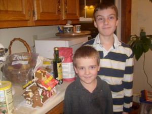 The boys by their gingerbread house