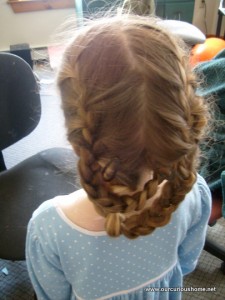 K's hair in two French braids