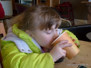 K drinking cocoa at the cafe at Briggs nursery