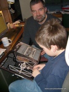 M reading a Star Wars Cross Section Book