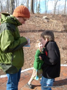 Ben distributing jelly beans to his siblings, they both trust him to do it fairly