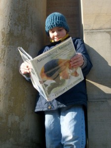 M reading in front of the Attleboro Public Library