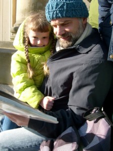 K and Daddy reading in front of the APL