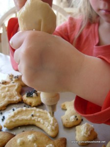 K decorating gf sugar cookies with pastry bag