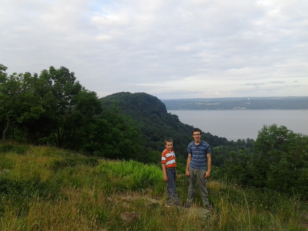 M and Ben on the hill behind my In-law's old house with Hook Mountain in the background and the Hudson River