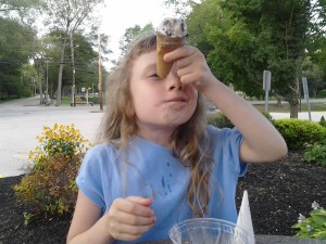 K peeking up her bitten  ice cream cone