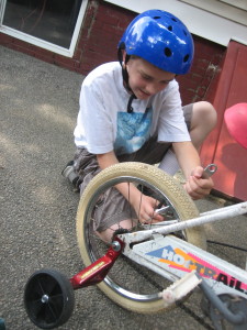 M fixing K's bike