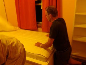Daddad smoothing the bed