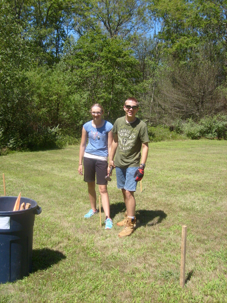 The sister/brother team of D. & A. pauses pounding so I can take their photo.