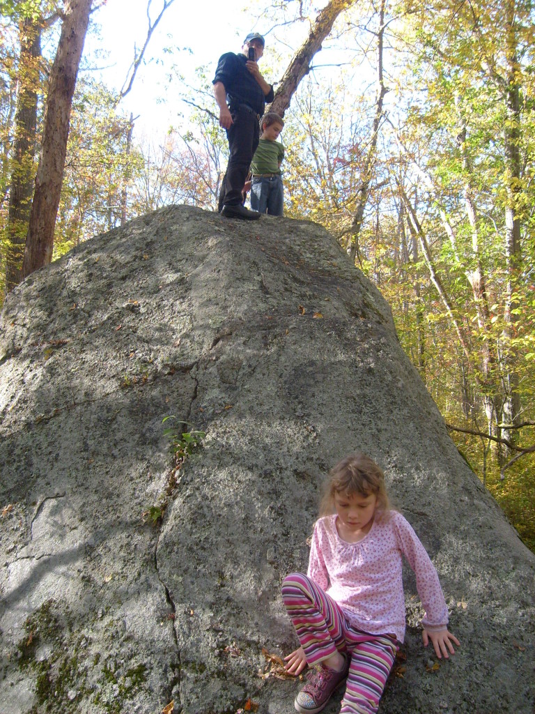 Dan, M and K on top of a rock, taking a photo of Me