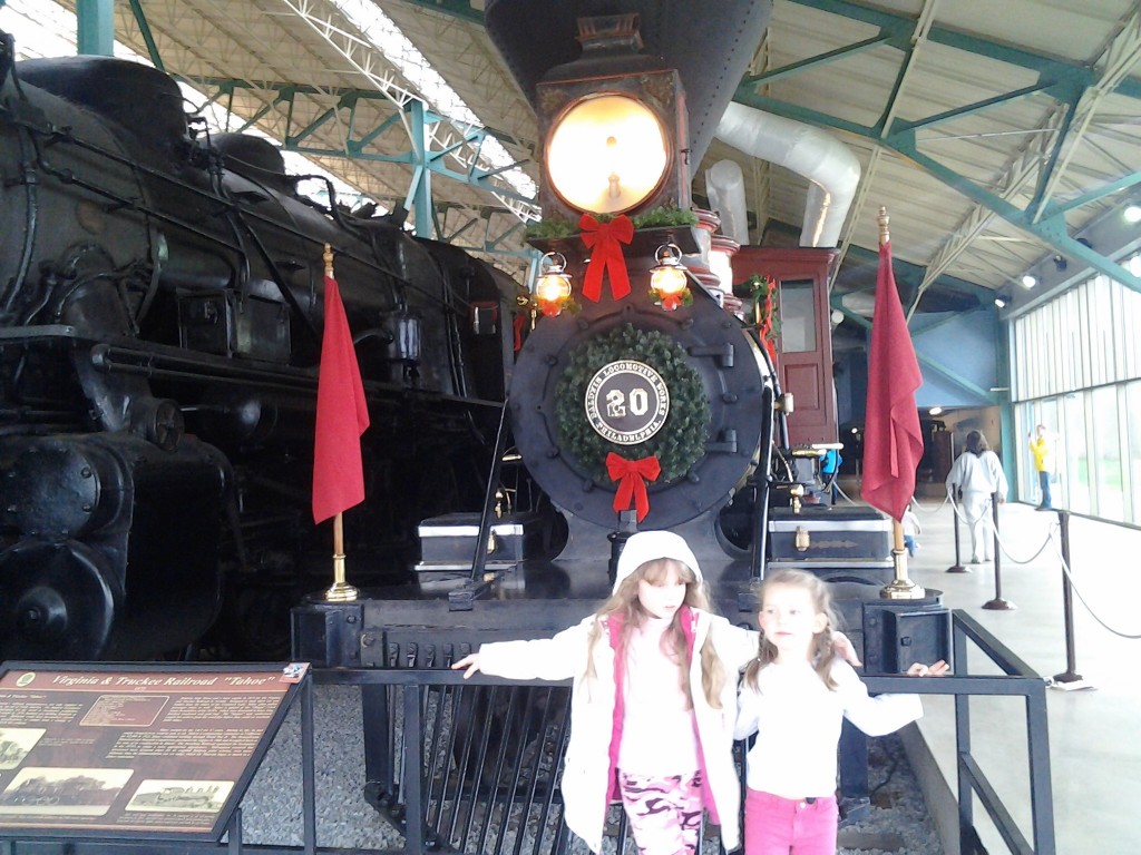 K and cousin by the engine with wreath