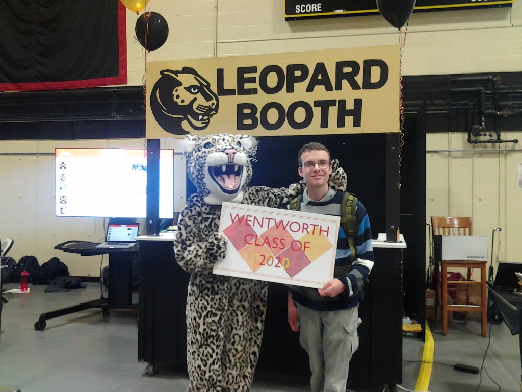 Benjamin poses with the Wentworth Leopard Mascot
