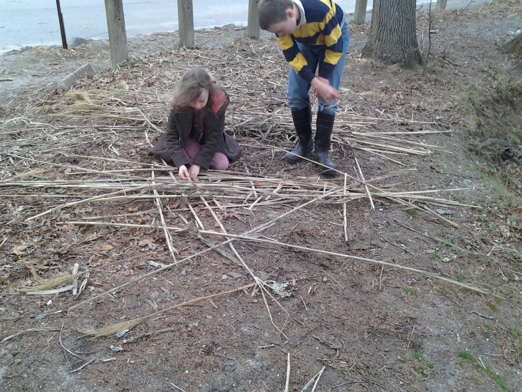 K. begins weaving reeds together to make the raft.