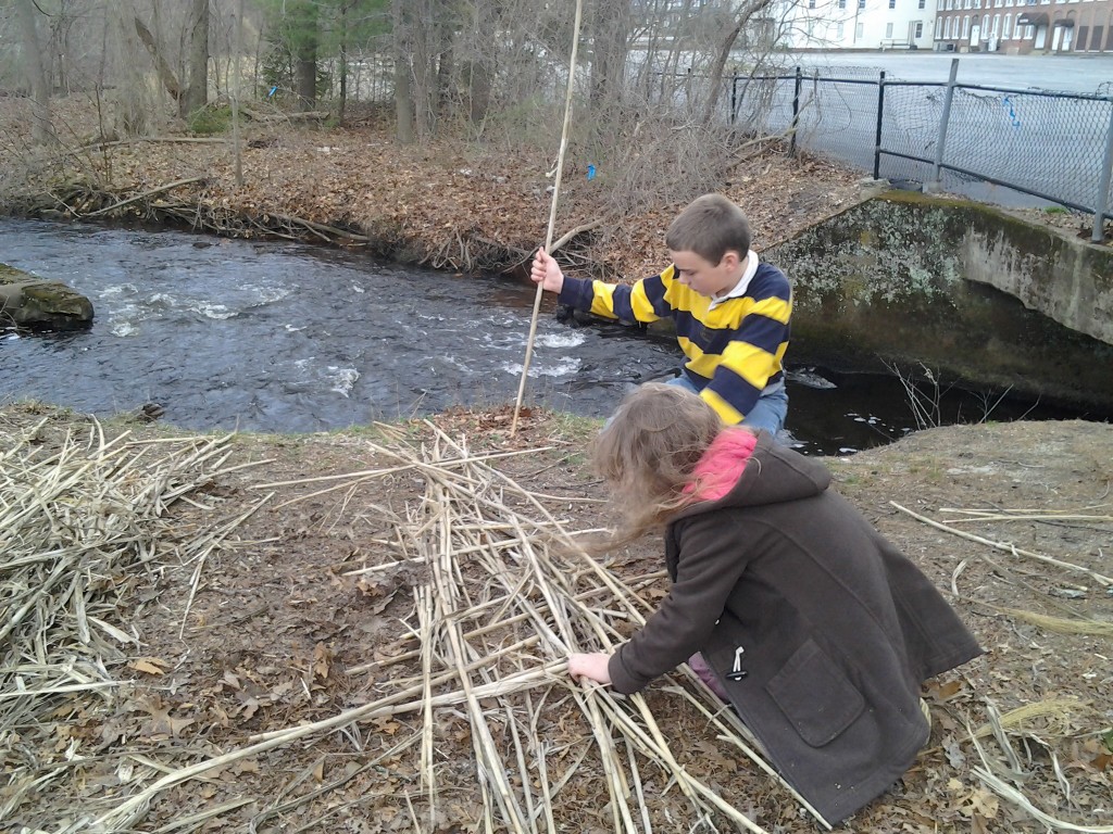 K and M weaving reeds to make the raft.