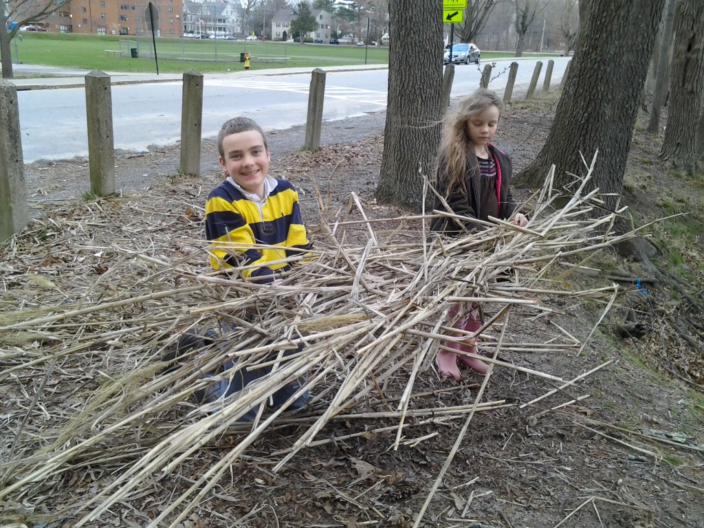 M and K hold up the nearly completed raft.