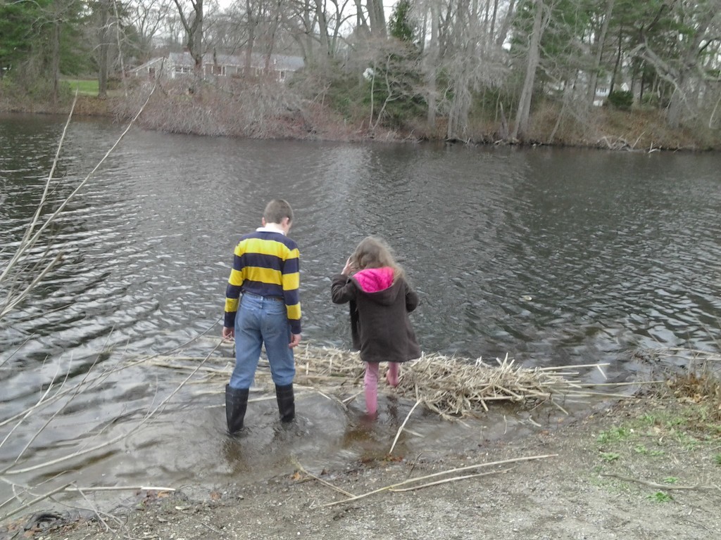 K steps on the raft to perform buoyancy testing.