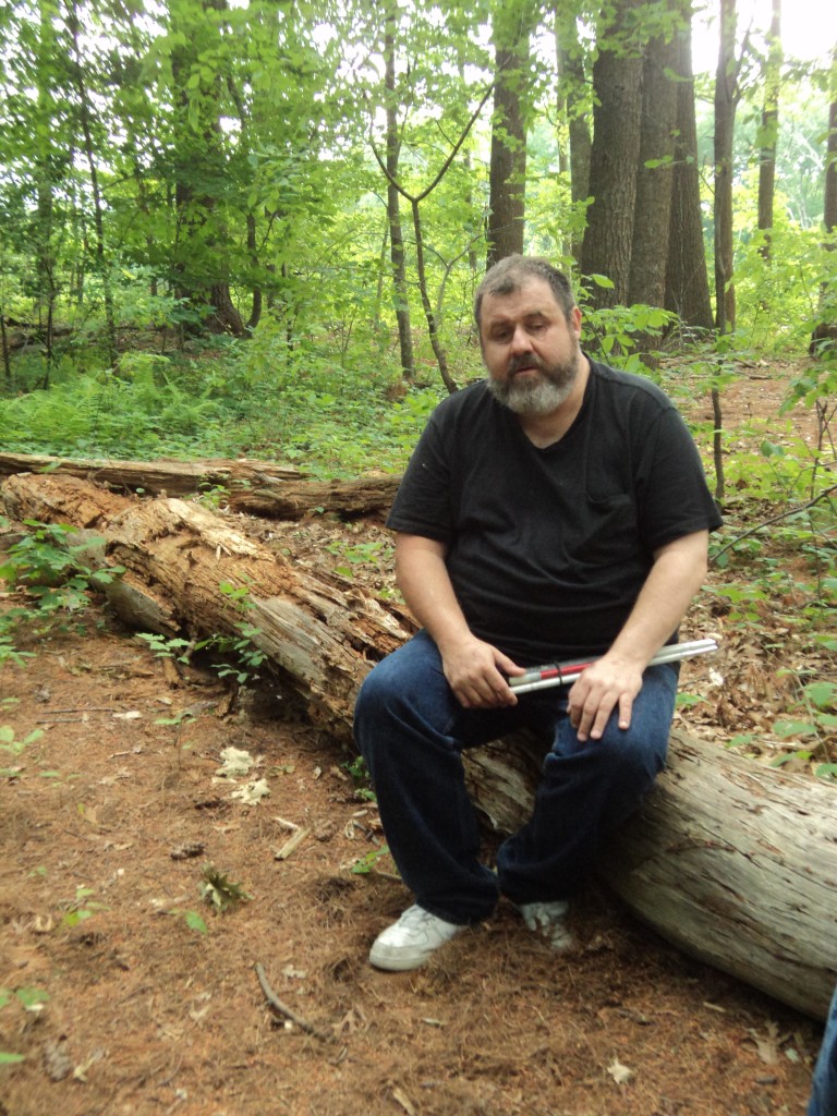 Warren resting on a log