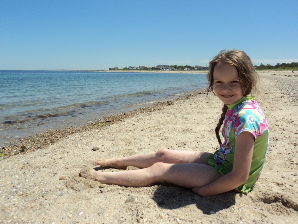 K sitting on the beach