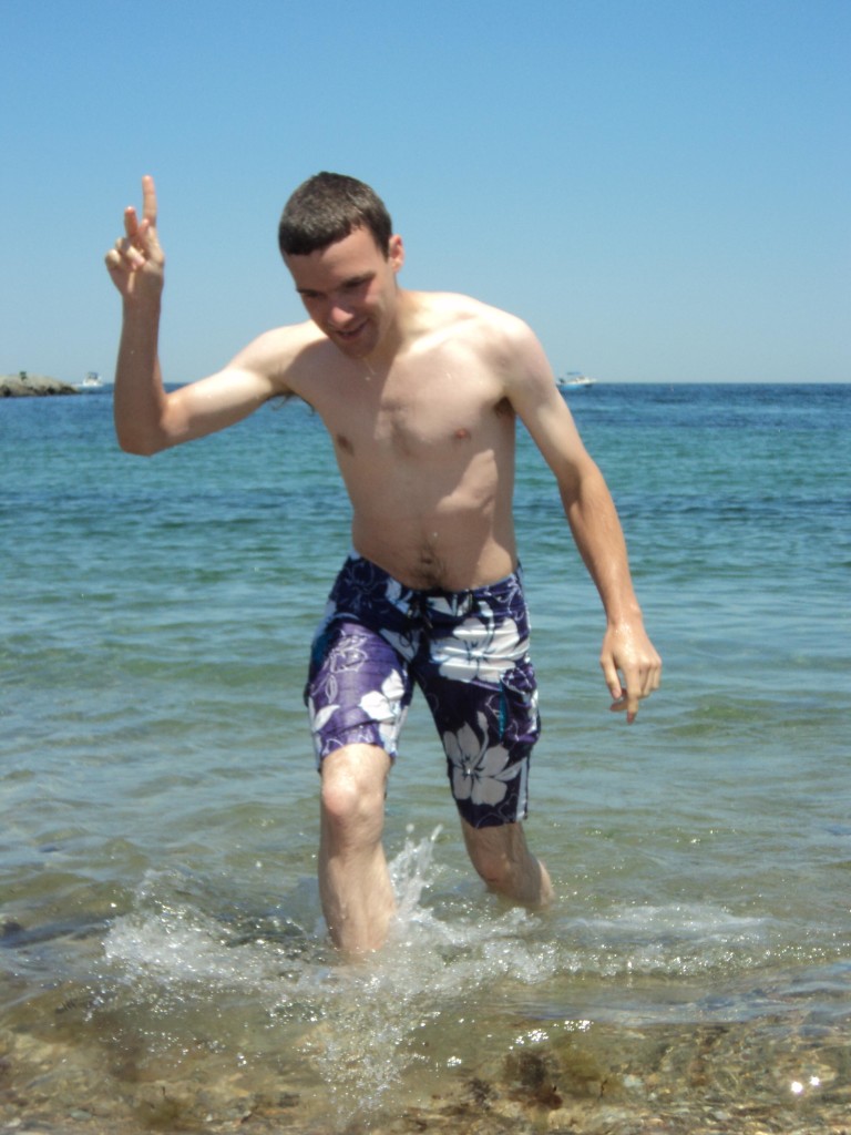 Ben splashing back to shore looking wet, cold and triumphant