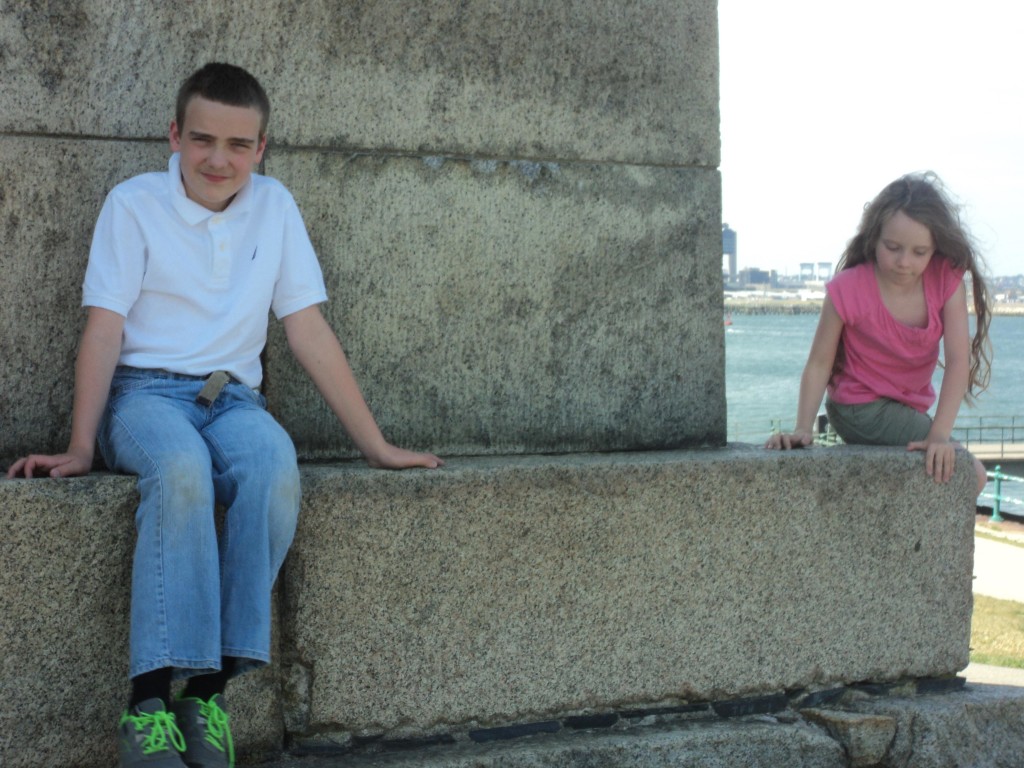 M and K climbing on a stone wall