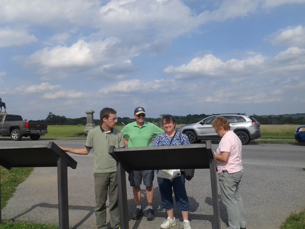 Ben, Daddad, Me, Mommom at a sign in Gettysburg