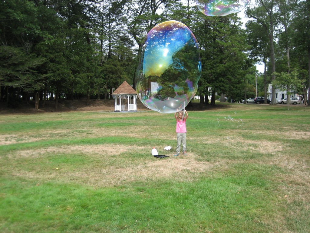 more of K waving bubbles in the park