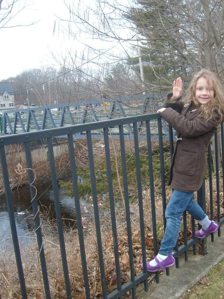 K waving from the railing