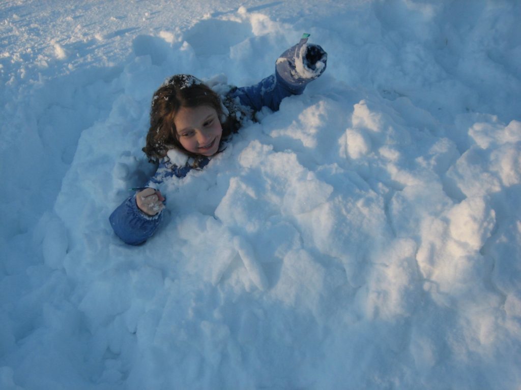 K climbing out of the snow