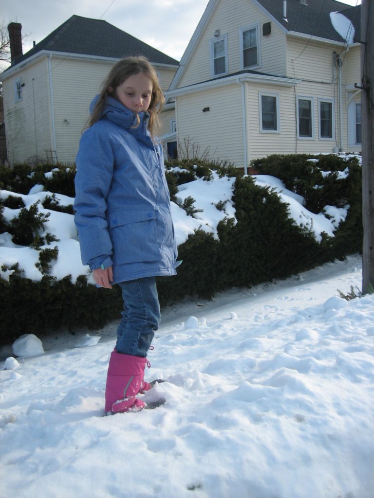 K looking dramatically down at the snow