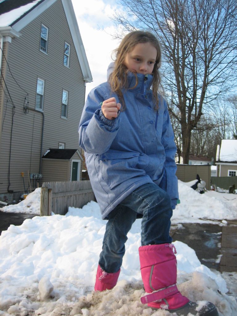 K pretending to be at the summit of Mt Everest while standing on a really high snowdrift