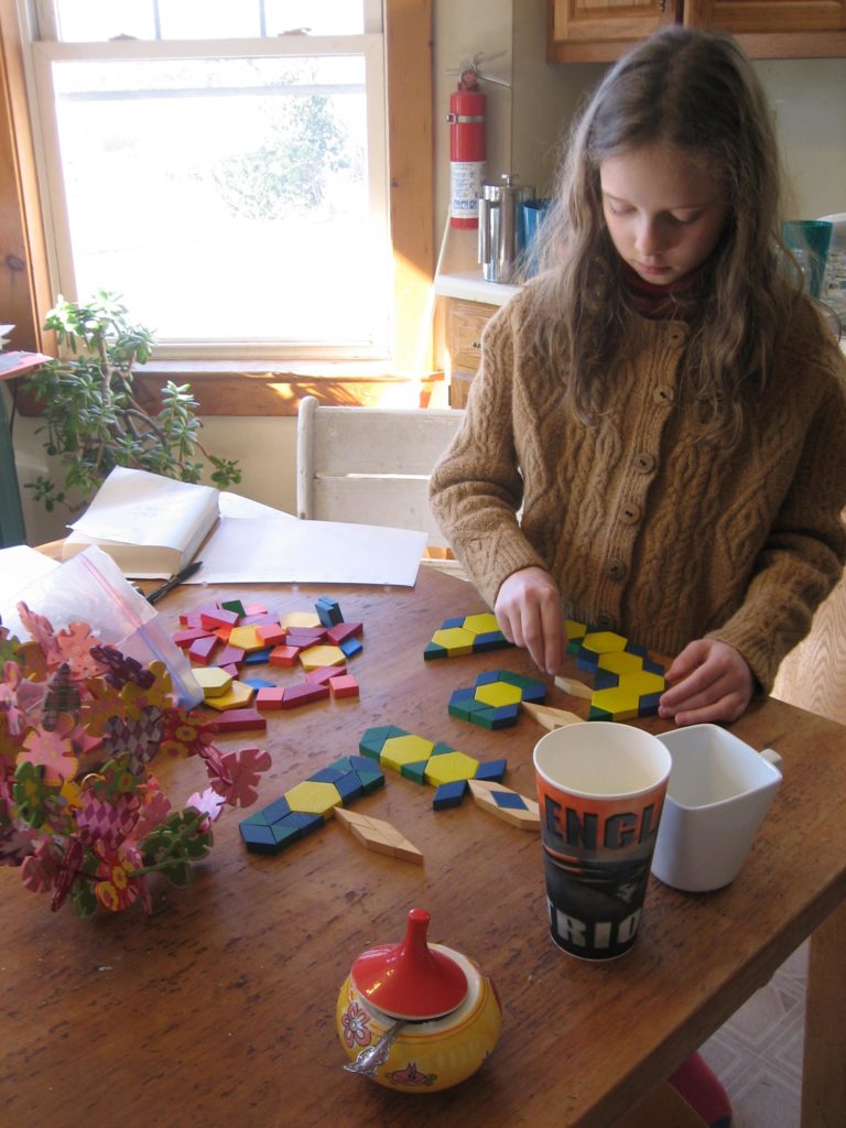 K building a Minecraft style ax, sword and bow out of pattern blocks