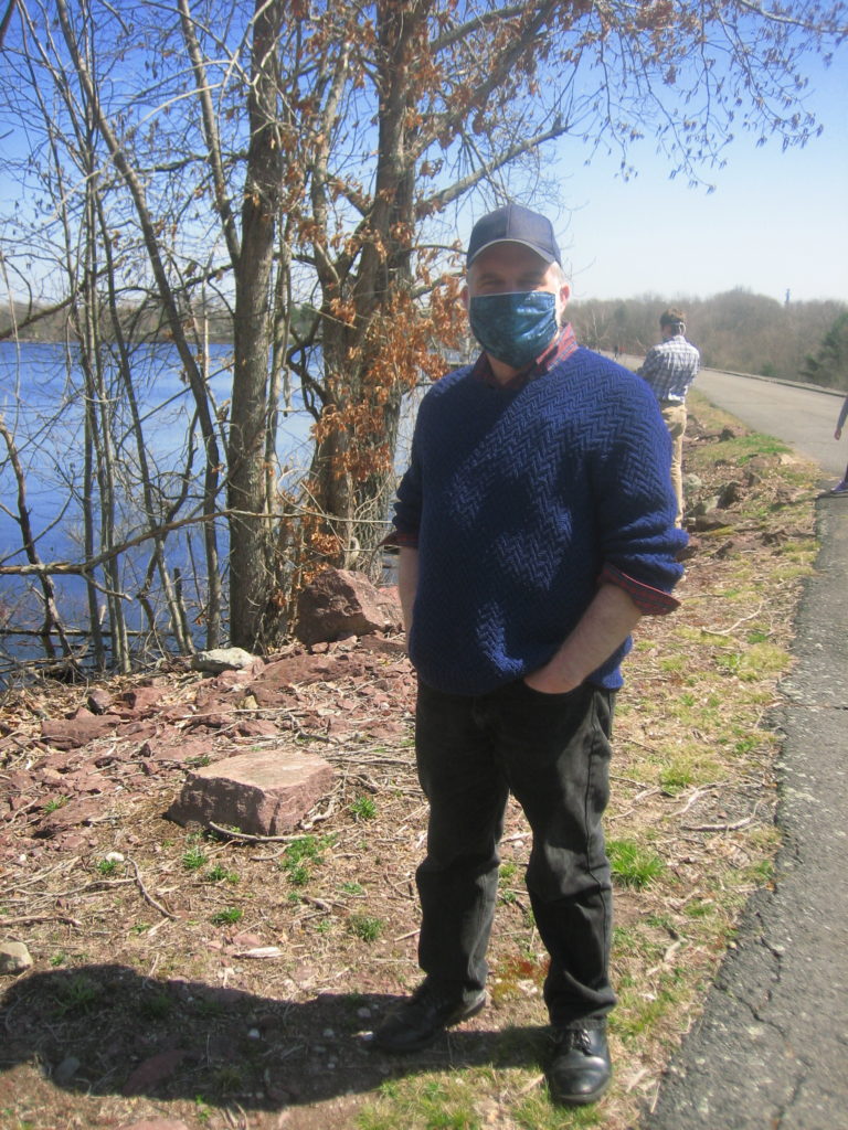 Dan in blue facemask on dam