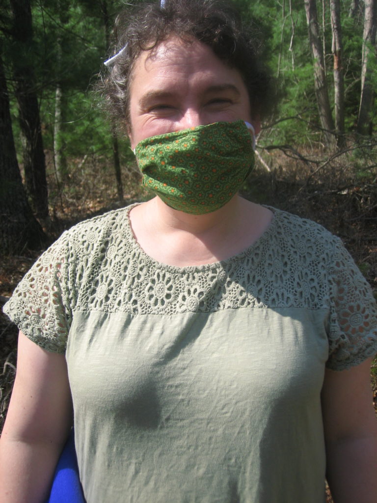 Christine wearing green facemask